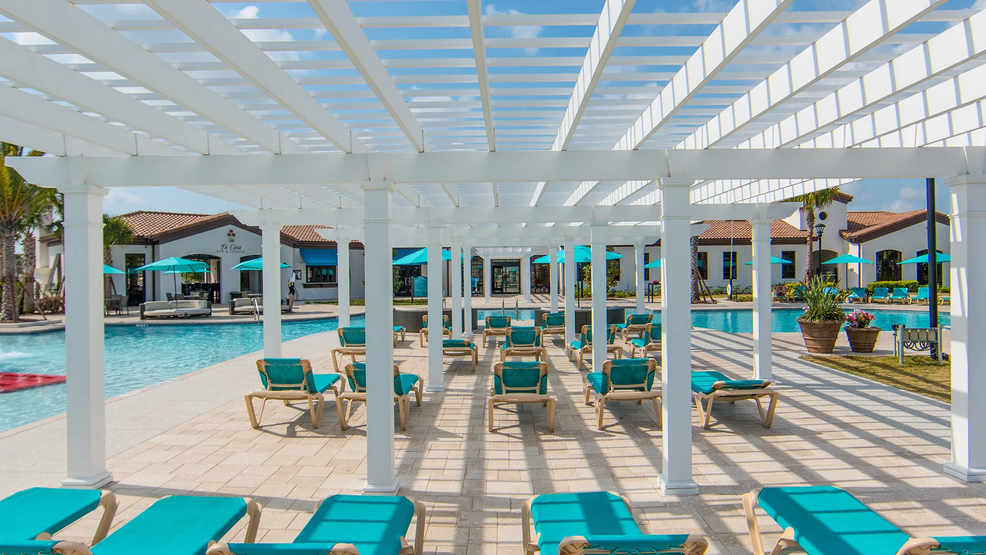 Beneath custom Trex Pergola poolside Orlando FL