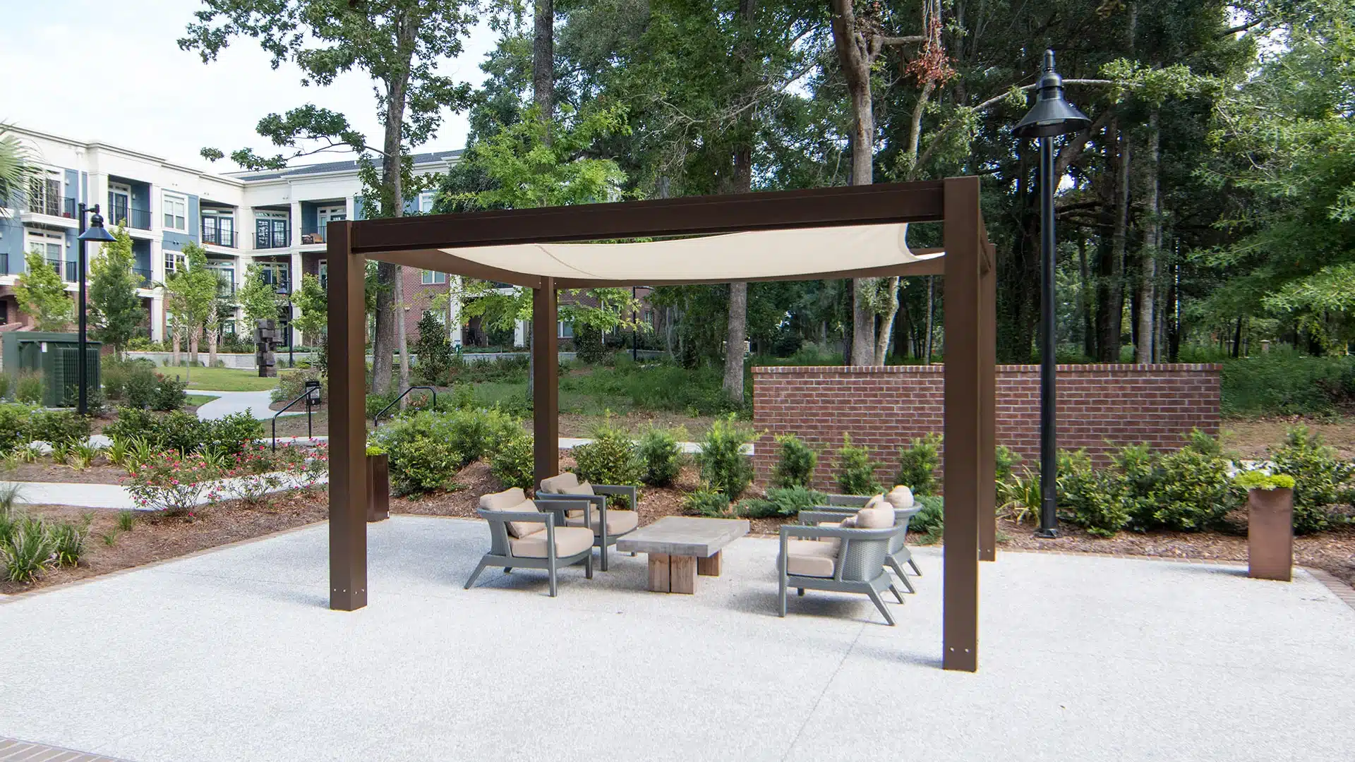 Brown Jordan aluminum pergola with tensioned shade canopy