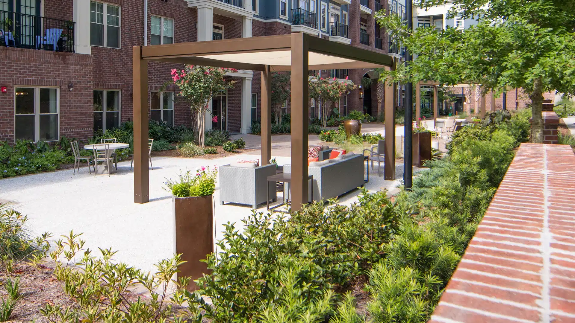 Brown Jordan aluminum pergola with tensioned shade canopy