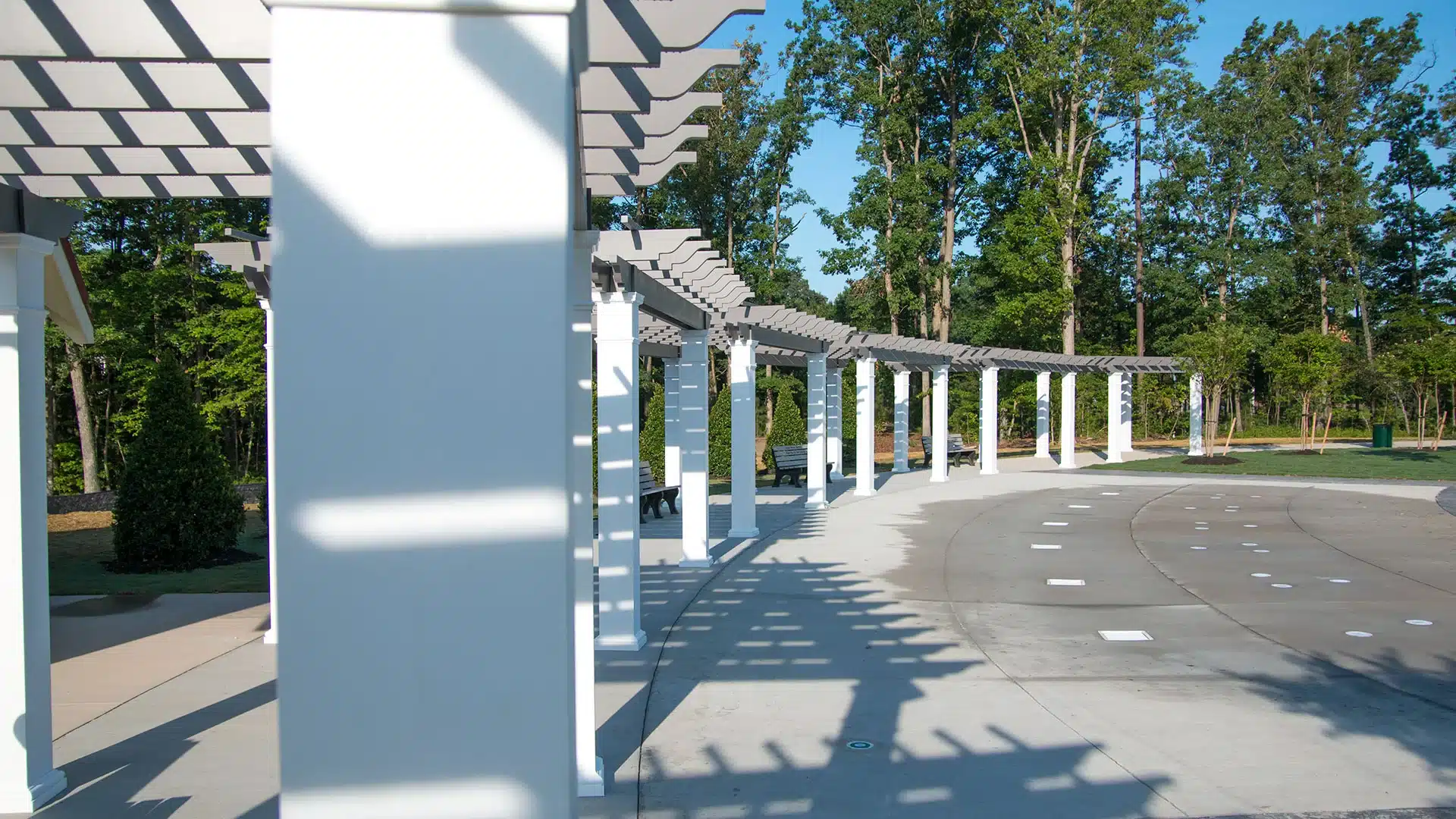 Gray fiberglass pergolas with white columns at Short Pump Park