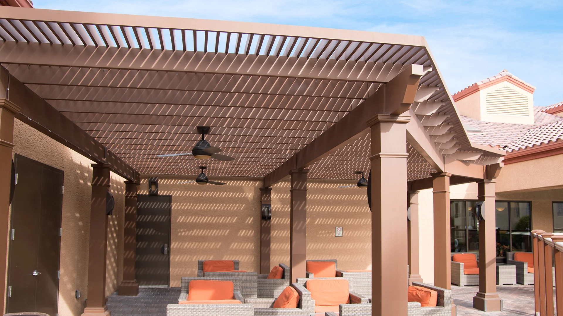 Featured image for “Holiday Inn: Custom Trex Pergola Kit in Las Vegas”Fong Construction worked with Holiday Inn Desert Club Resort located in Las Vegas to create a shade producing custom Trex Pergola. They wanted to provide respite for resort guests and pool goers from Nevada’s sweltering sun, while incorporating electrical features for added amenities.12338:full