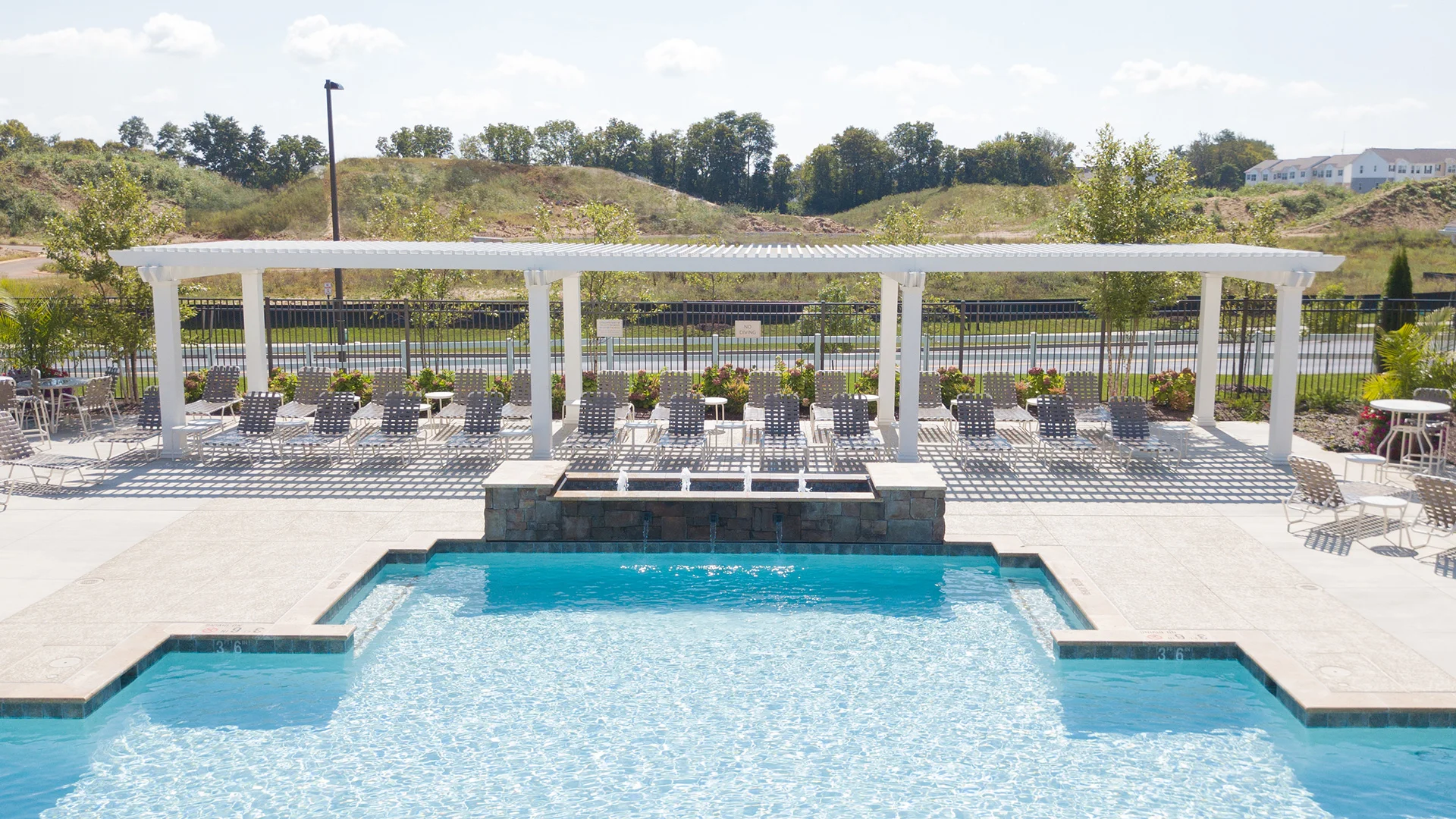 Fiberglass pergola poolside in multi-family apartment community