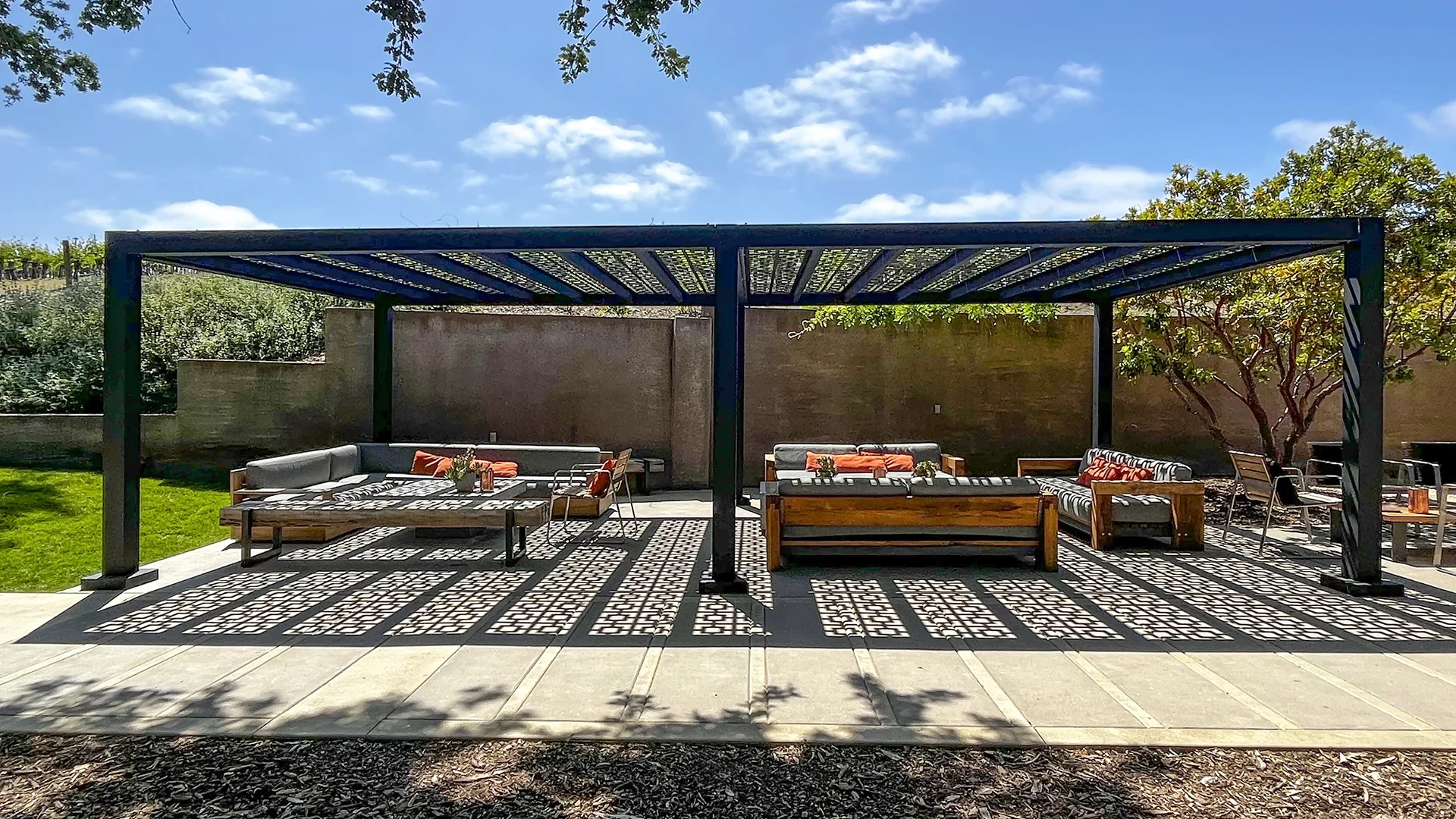 Featured image for “Brecon Estate Winery, CA”Brecon Estate Winery is a central California winery with a laid back Austrailian style. A tailored Trex Pergola Shadow, manufactured by Structureworks is used to provide respite from the sun as part of the outdoor tasting area.14491:full