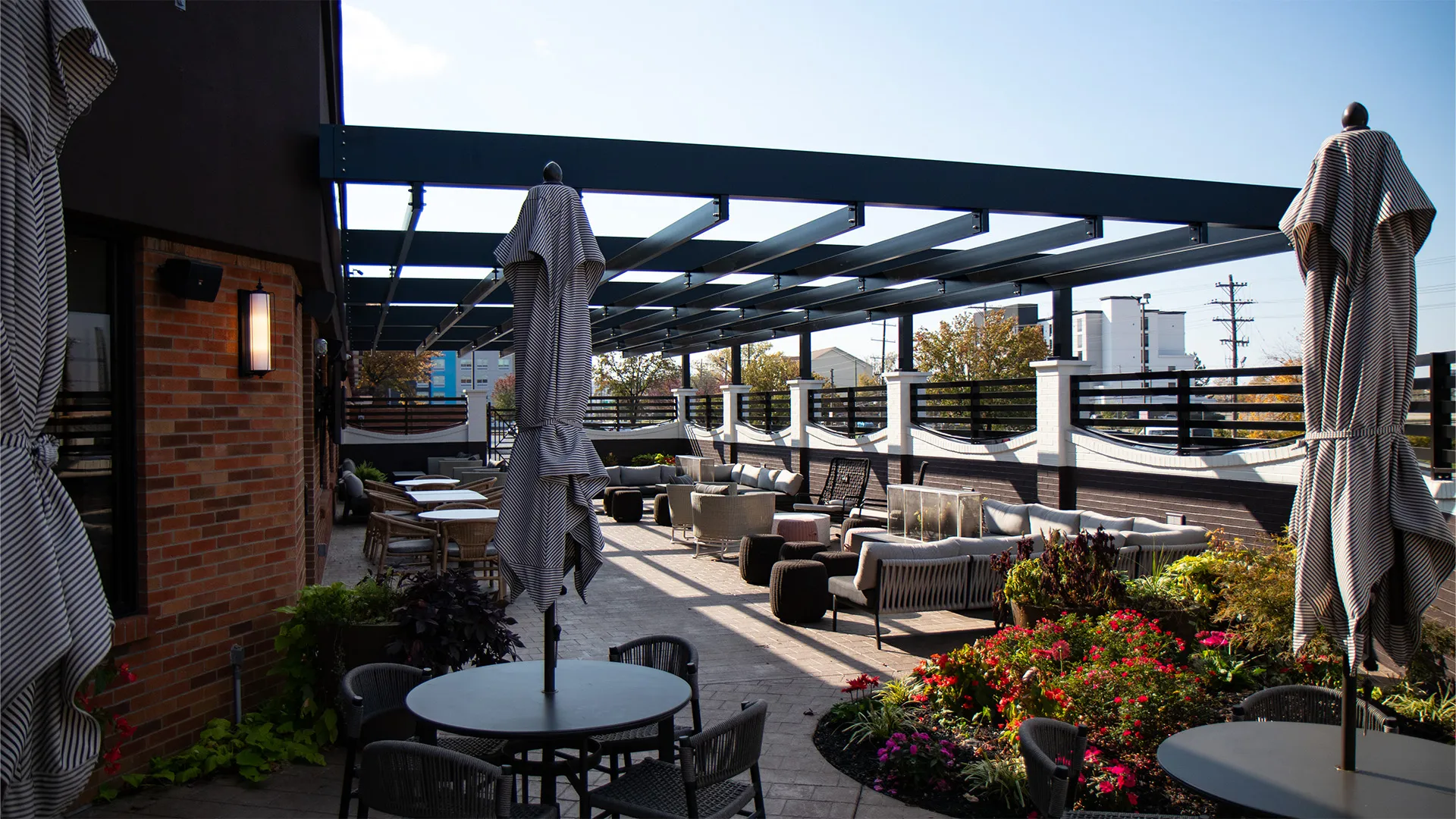 Aluminum pergola over outdoor restaurant seating at Crown Plaza Hotel in Louisville. KY